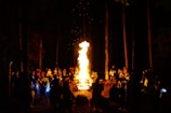 Guests gathered around a warm bonfire in the forest, sharing stories and laughter