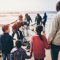 group of people standing on seashore