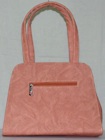 A spacious and practical maternity bag with multiple compartments on a soft pastel background