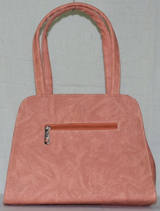 A stylish pink handbag displayed on a soft purple background.