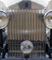 Rolls Royce grille detail showcasing craftsmanship and premium quality.
