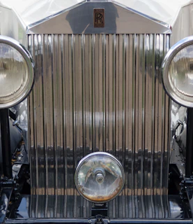 Rolls Royce grille detail showcasing craftsmanship and premium quality.