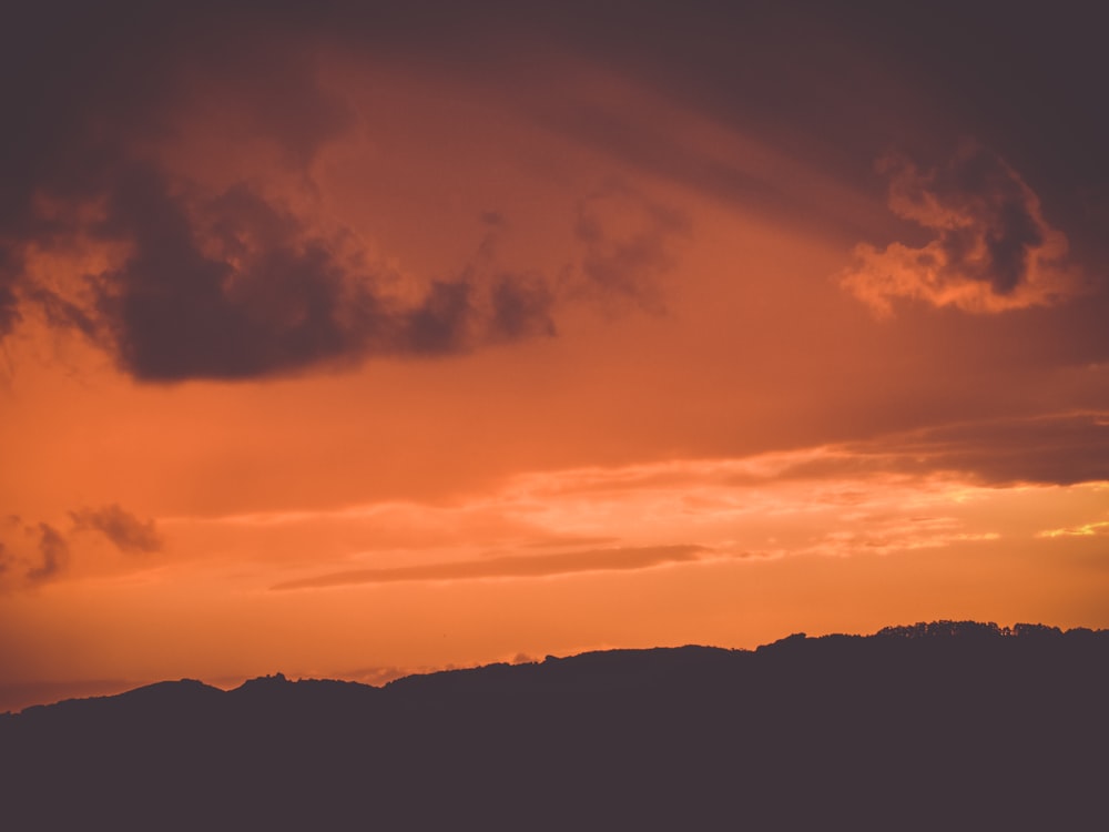 silhouette of mountains during golden hour