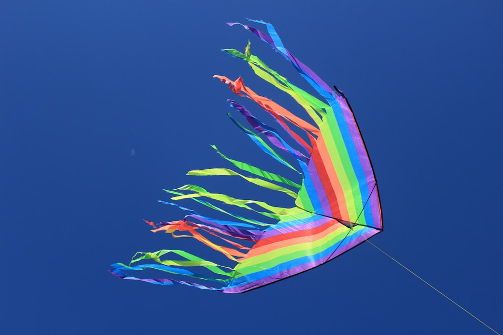 multicolored kite under clear sky