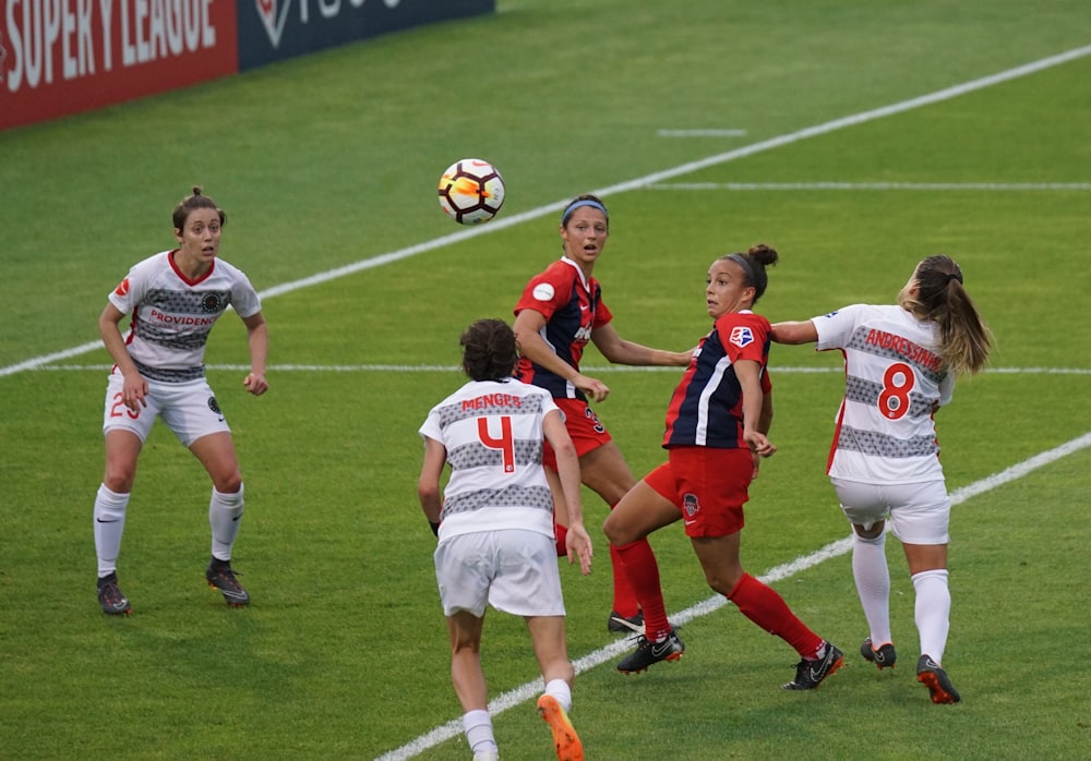 group of female playing soccer