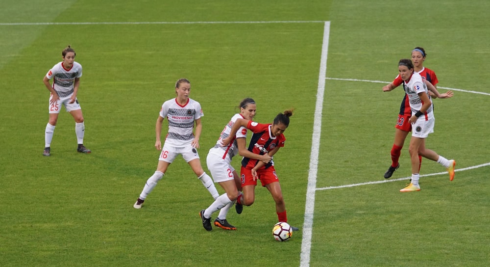 group of females playing soccer