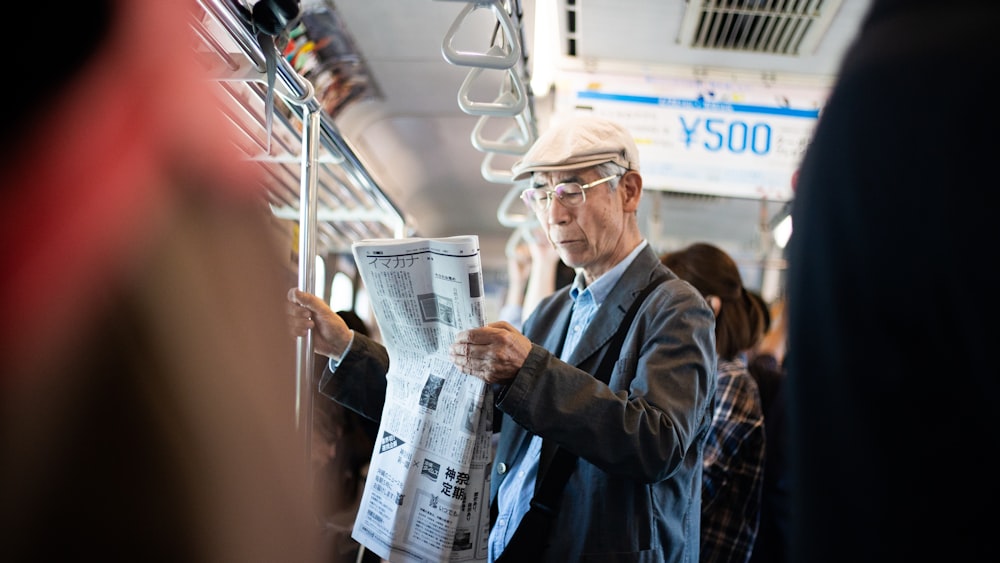 man holding newspaper