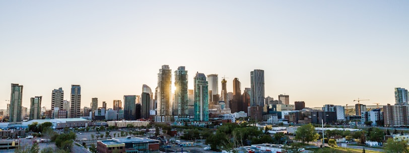 silhouette of high-rise building during daytime