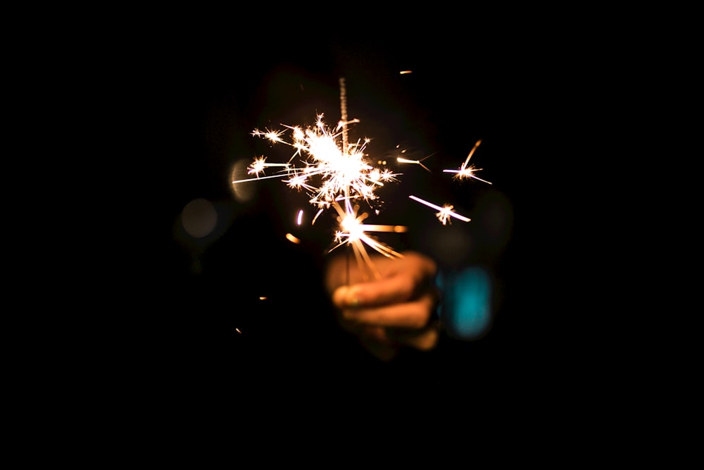 person holding firecracker