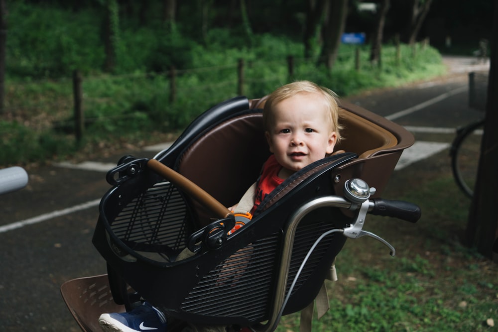 baby's black and red bike seat