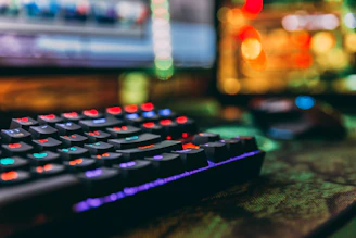 Close-up of colorful computer accessories like keyboards and mice on a bright background