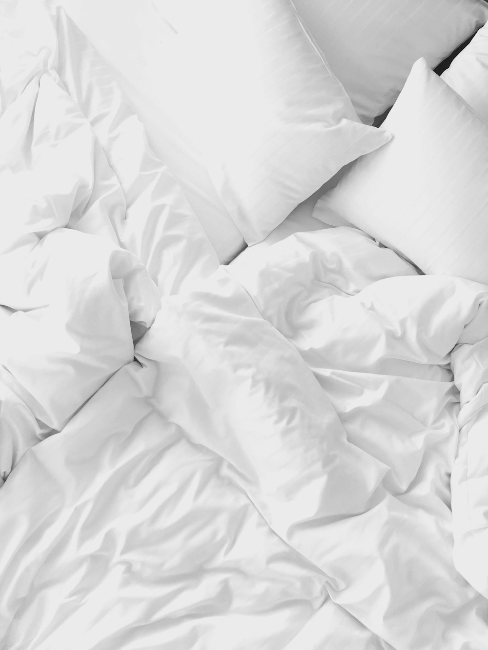 white pillows on bed