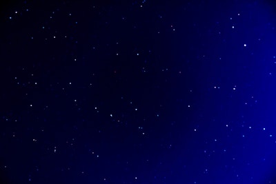 A serene night sky with deep blue and golden stars reflecting the minimalistic European style.