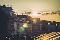 Sunset over the historic buildings of Recife with warm golden light.