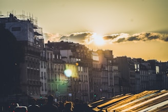 Sunset over the historic buildings of Recife with warm golden light.