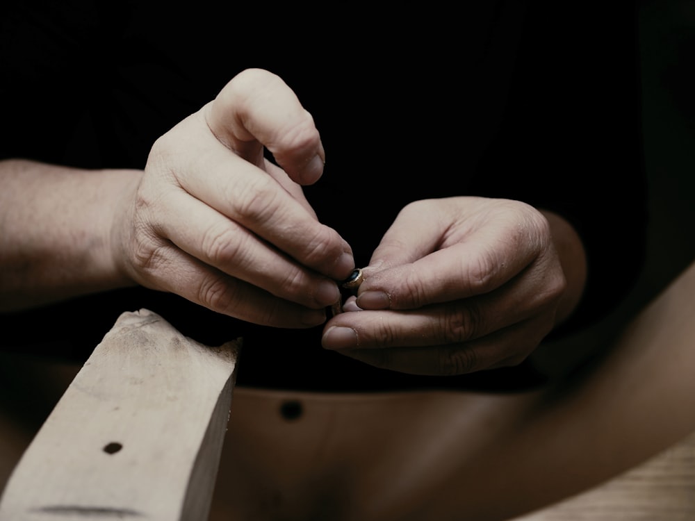 person holding stone