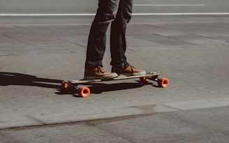 person riding skateboard on road
