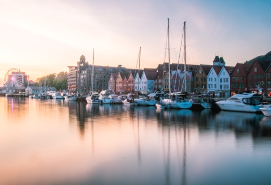 white sail boats near buildings in Bryggen Norway