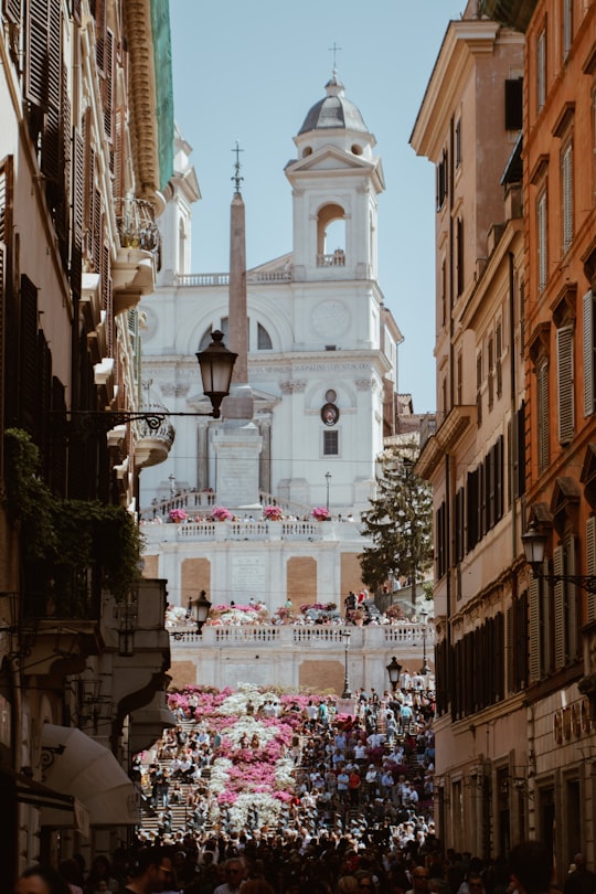 white concrete gothic building surrounding people in Spanish Steps Italy