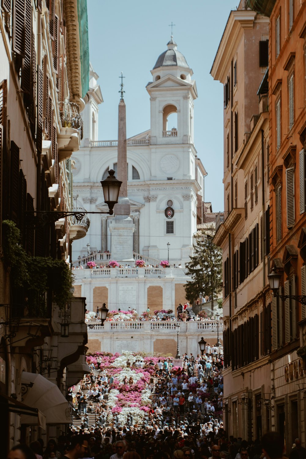 white concrete gothic building surrounding people