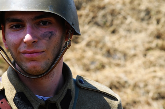 A candid photo of me wearing my airsoft gear, smiling after a game.