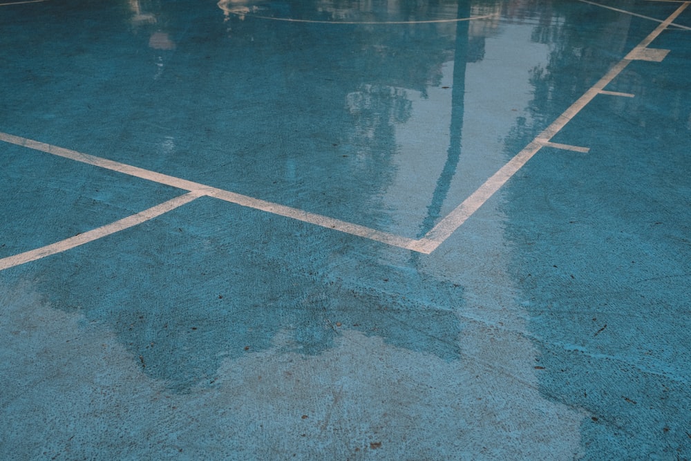 blue and white basketball court at daytime