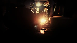 A warm cup of tea resting on a table next to a softly glowing candle, symbolizing calm and safety.