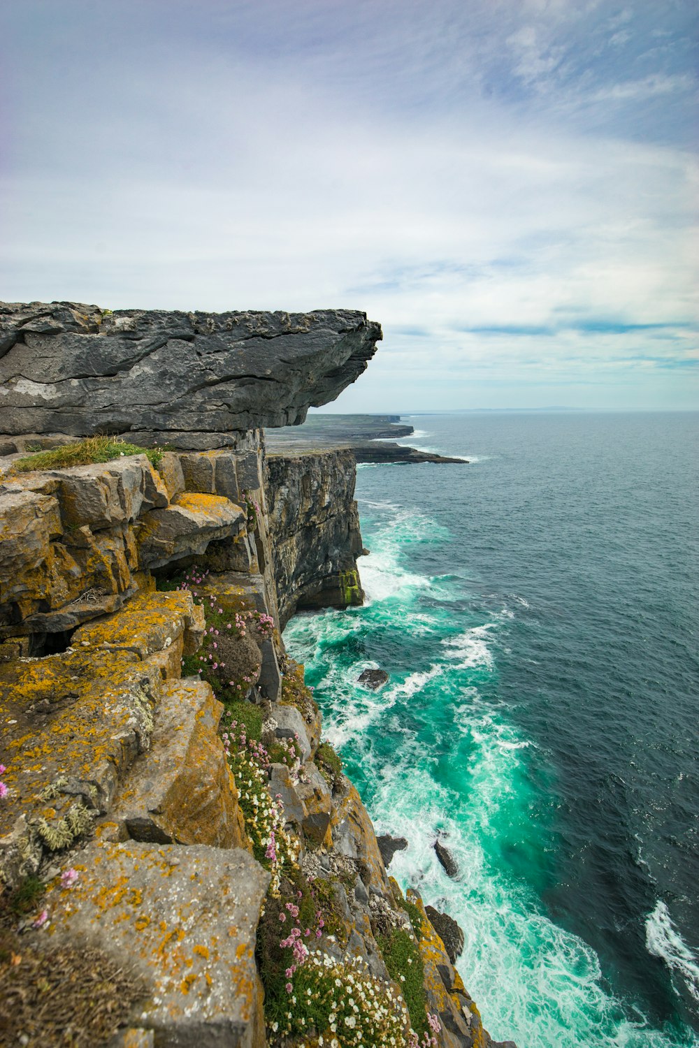 rock cliff with cloudy sky