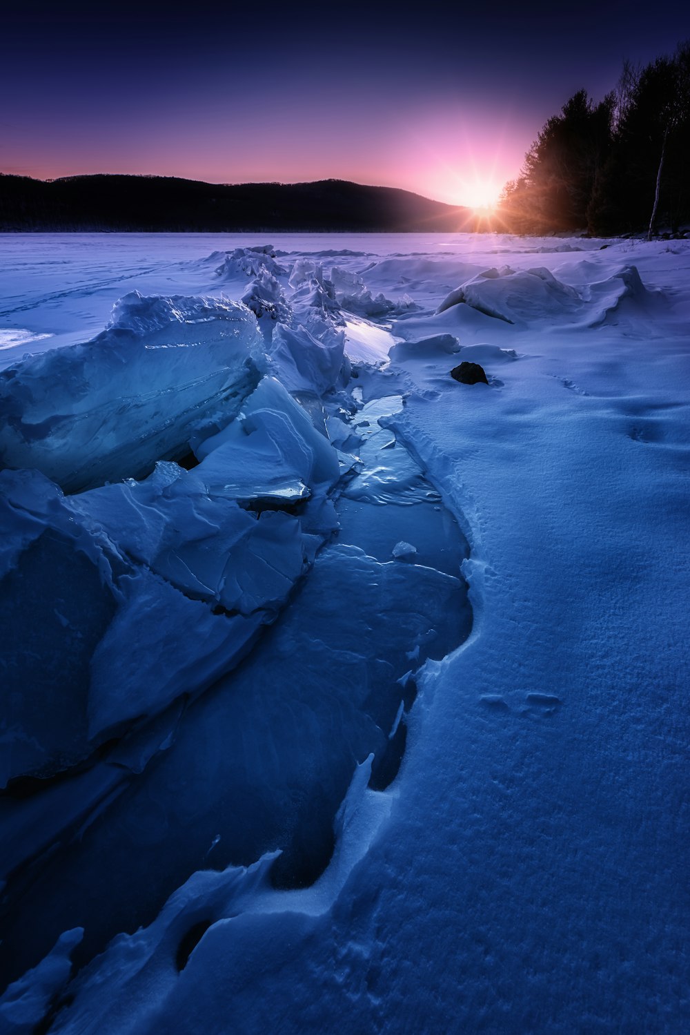 river between snows at blue hour