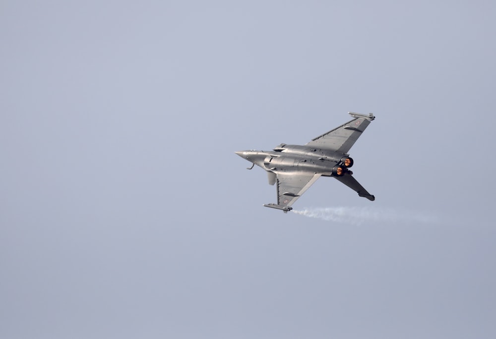 gray fighter jet in the sky