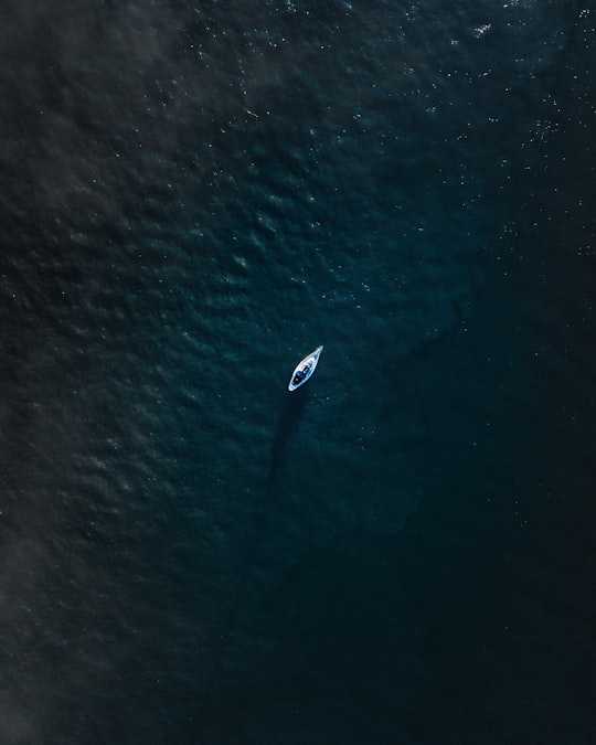 aerial photo of white and blue sailboat in Mersea Island United Kingdom