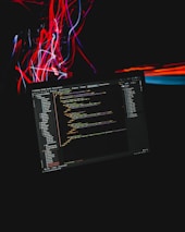 A dynamic shot of a developer coding with holographic data visuals floating around.