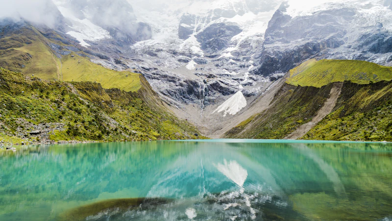 The turquoise glacial water of Humantay Lake below Salkantay, Peru