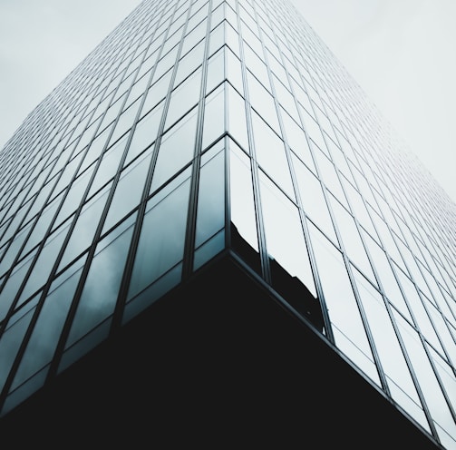 low angle photo of glass architecture wallpaper