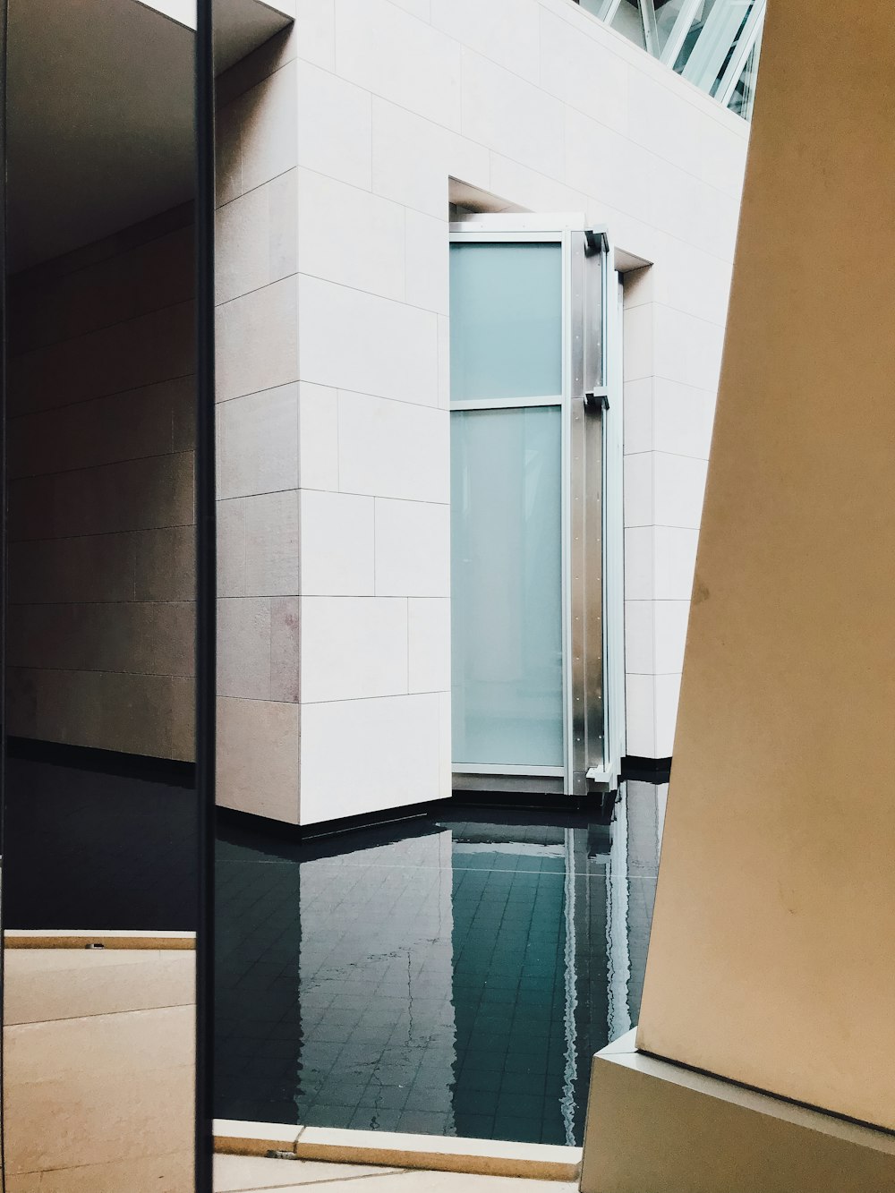 Louis Vuitton building surrounded by body of water photo – Free Louis  vuitton island Image on Unsplash