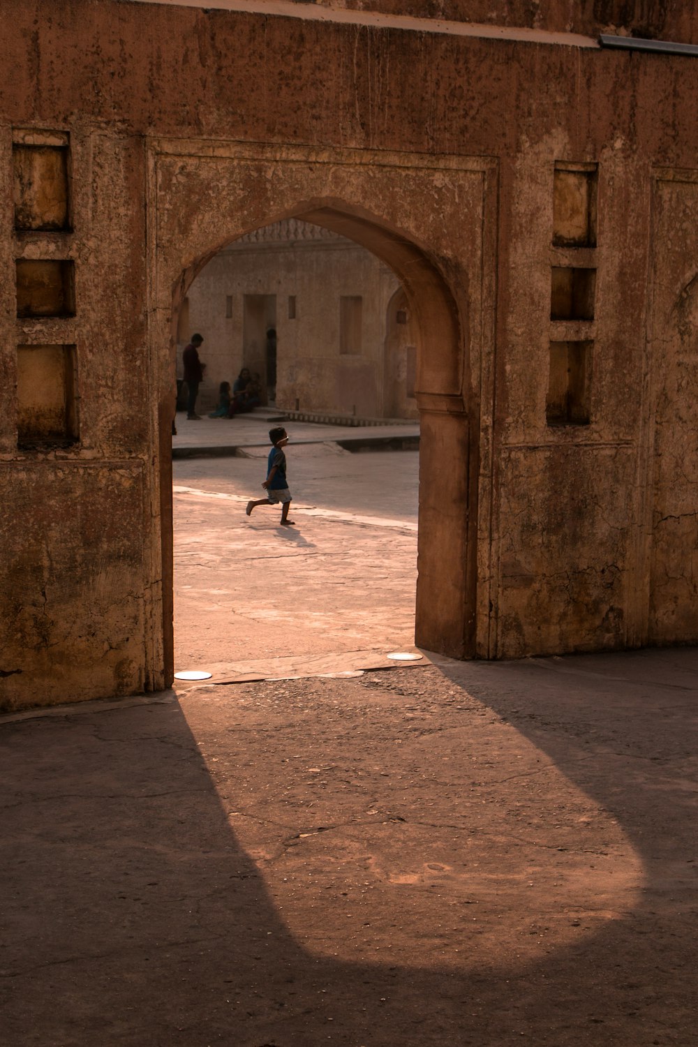 person walking on sidewalk during daytime