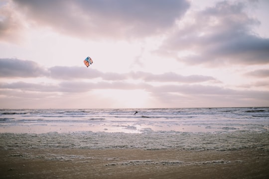 person doing water activity during sunset in Katwijk aan Zee Netherlands