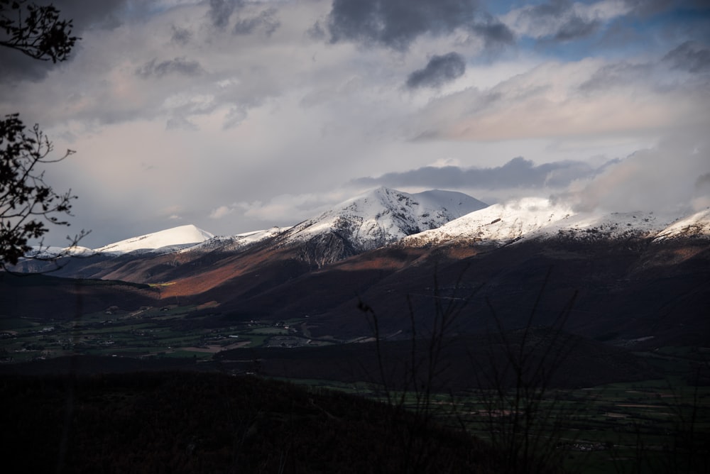 brown mountain cover with snow