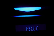 A friendly AI assistant interface glowing softly on a modern screen.