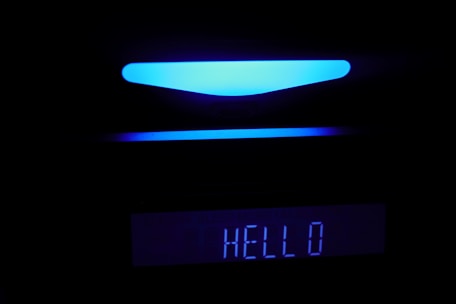 A sleek, futuristic AI voice receptionist interface glowing in yellow and black.