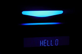 A friendly AI assistant interface glowing softly on a modern screen.