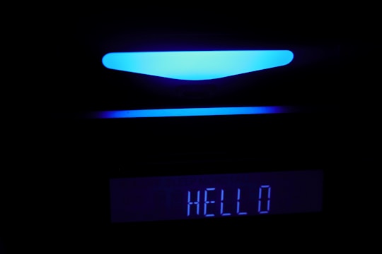 A sleek, futuristic voicebot interface glowing softly against a dark purple-blue gradient background.
