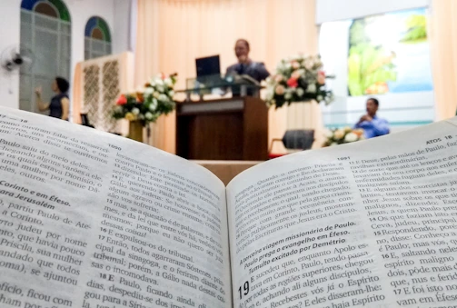 Leaders and future ministers in a focused training session with open Bibles.