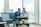 two men in suit sitting on sofa