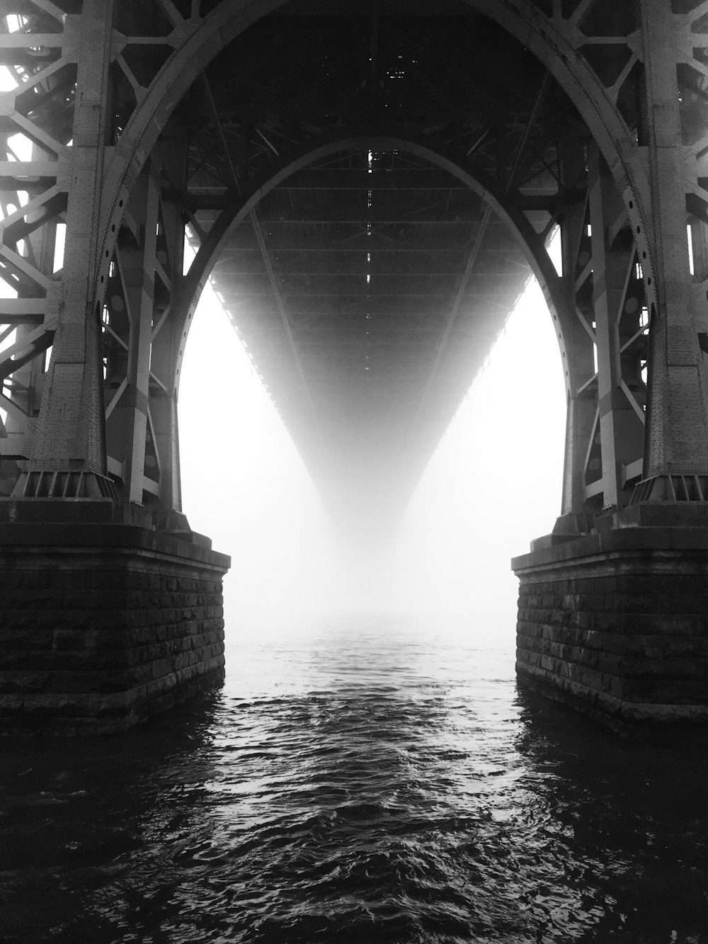 grayscale photo of bridge over water