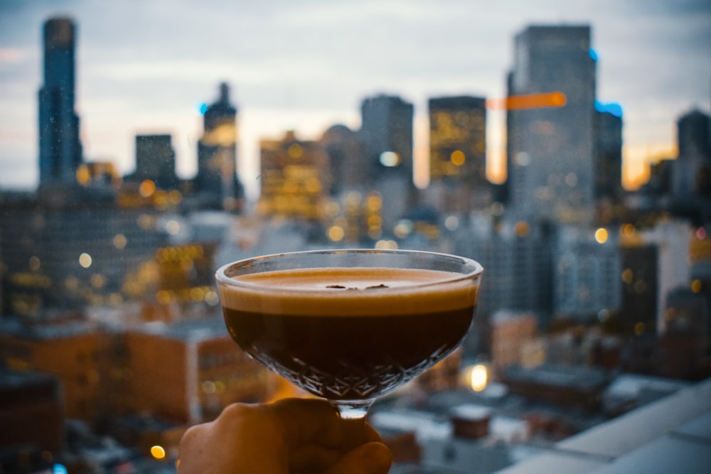 person holding sorbet glass