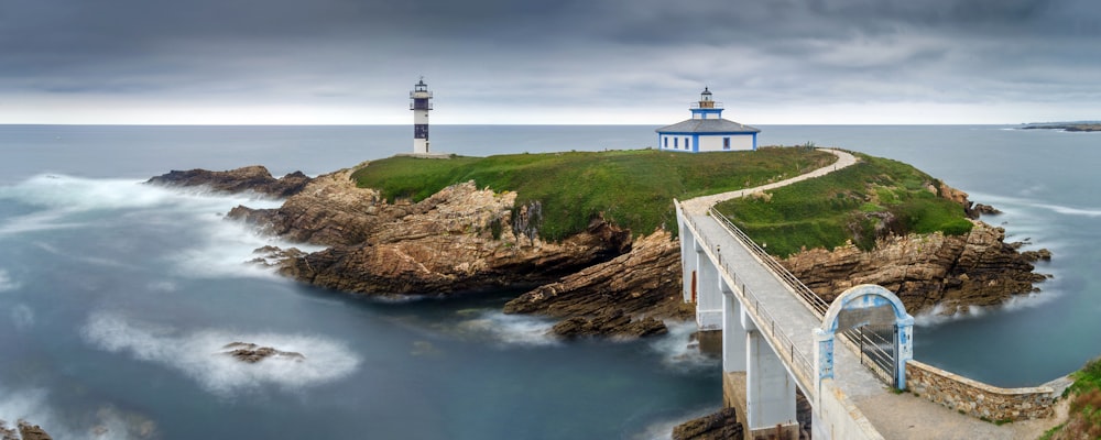 lighthouse on islet with bridge