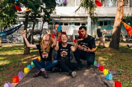 four people sitting near road
