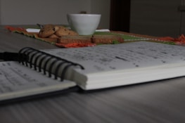A close-up of a journal open with notes about celiac research and personal reflections.