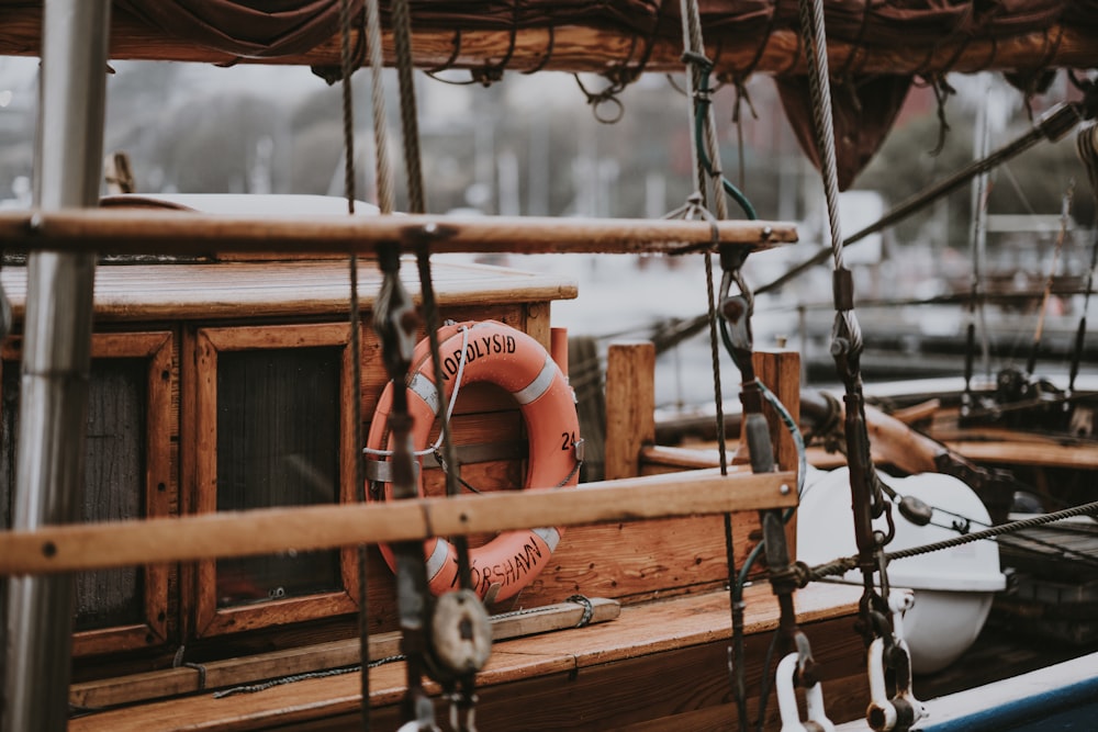 orange buoy ring mounted on ship